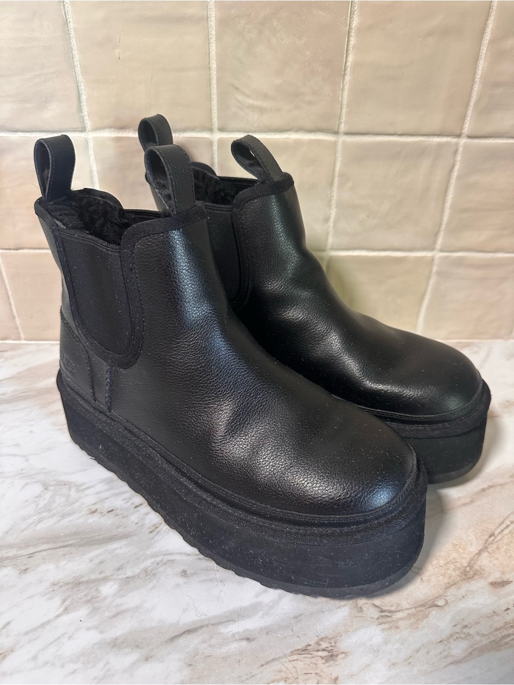 UGG Neumel Platform Chelsea Boots in black leather. Size 9